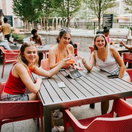 women having cocktails outside