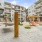 a courtyard with buildings and tables