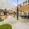 a courtyard with a bench and a building