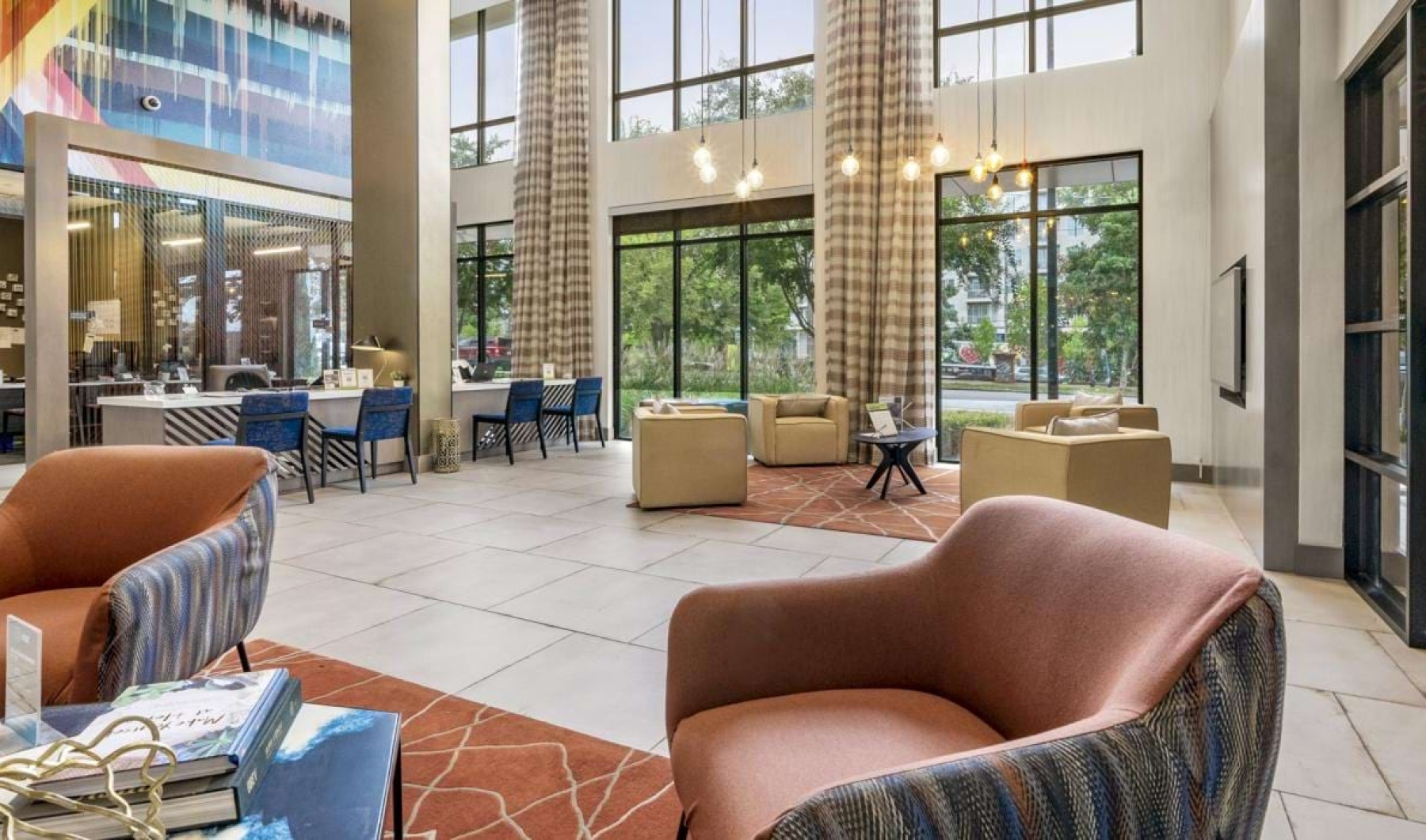a room with a large glass wall and a table with chairs and a flag