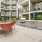 a patio with tables and chairs outside