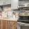 a kitchen with a stove and microwave
