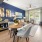 a living room with a table and chairs