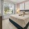 a bedroom with a large window