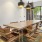a dining room with a table and chairs