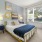 a bedroom with a bed and a plant